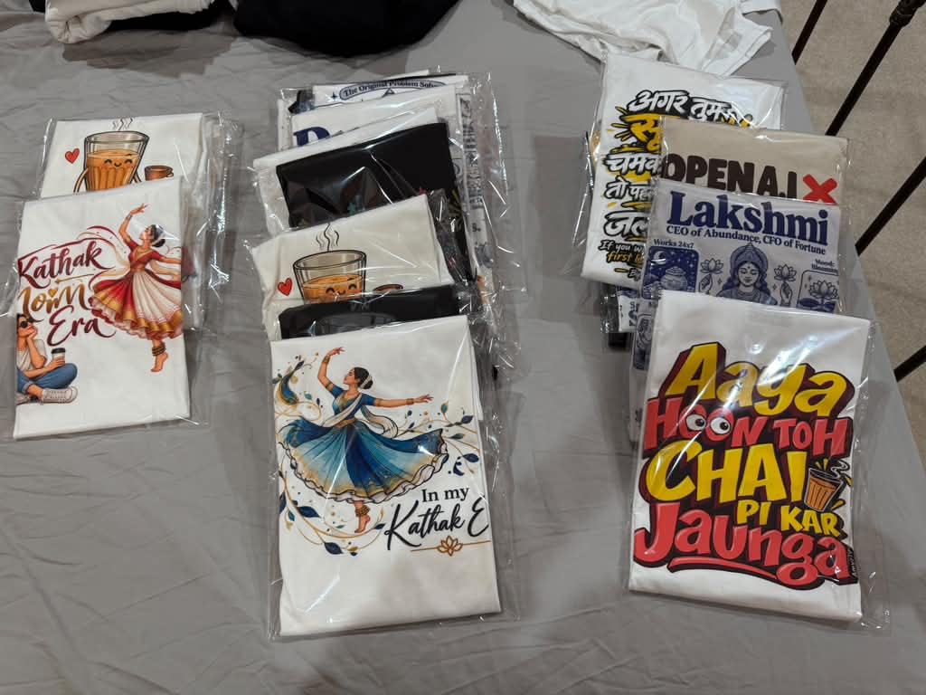 A set of individually packaged custom graphic T-shirts