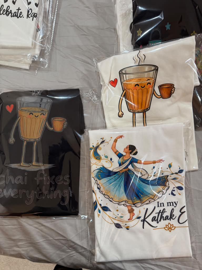 Custom printed apparel and drinkware arranged as a gift set