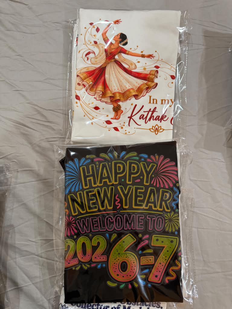 Custom printed shirts featuring a Kathak dancer and a New Year design
